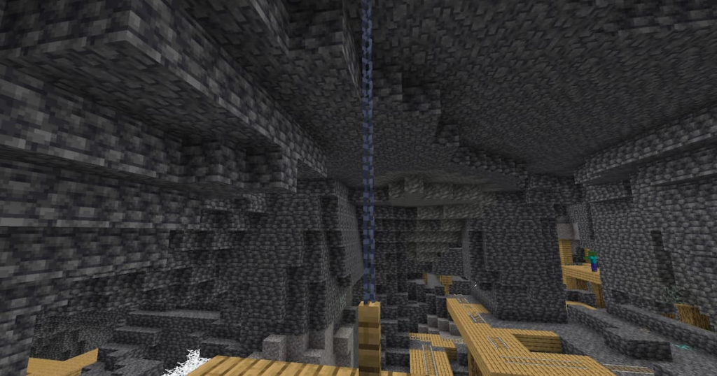 Chains on a mineshaft platform, connecting it to the ceiling.