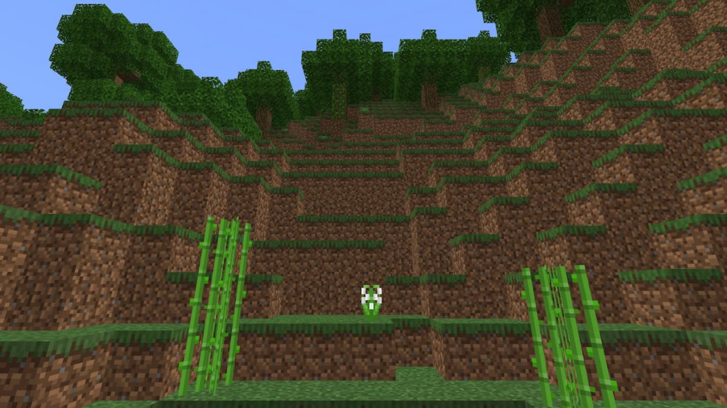 A Lily of the Valley growing in a Forest biome in Minecraft.