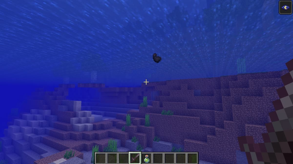 A squid dropping two ink sacs in Minecraft.