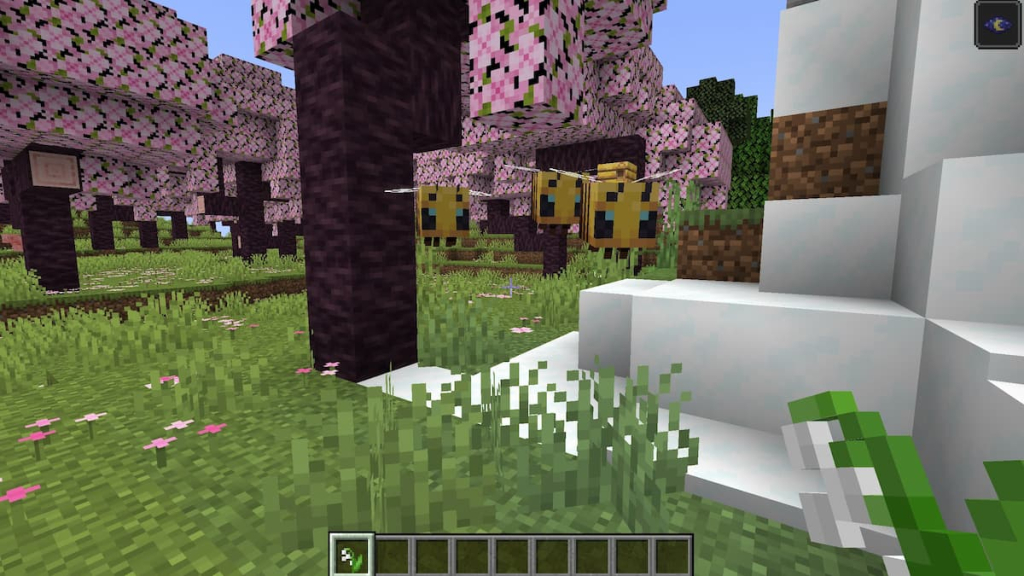 Three bees following a player holding a Lily of the Valley in Minecraft.