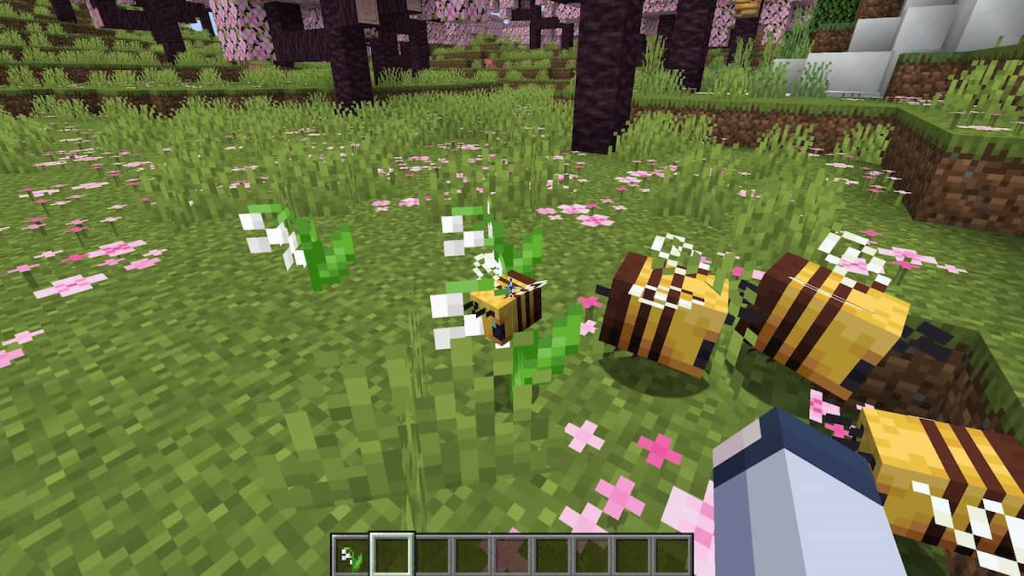A bee gathering pollen from a Lily of the Valley in Minecraft.