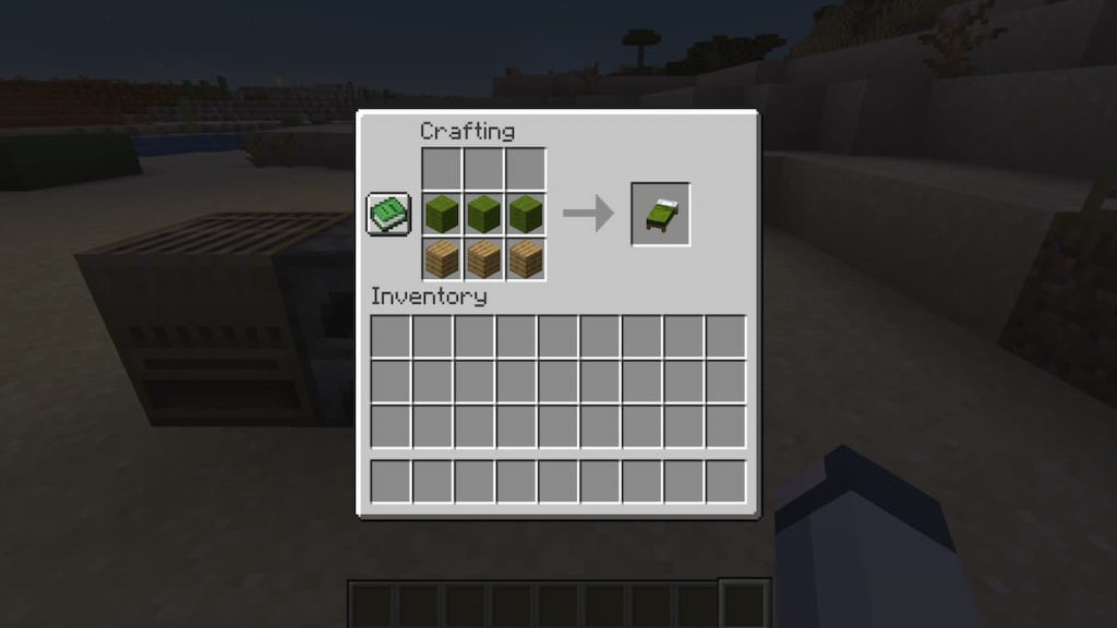 Crafting a green bed from green wool and wood planks.